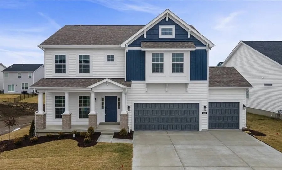 Two-story new construction home with a front porch, used as a floor plan card photo